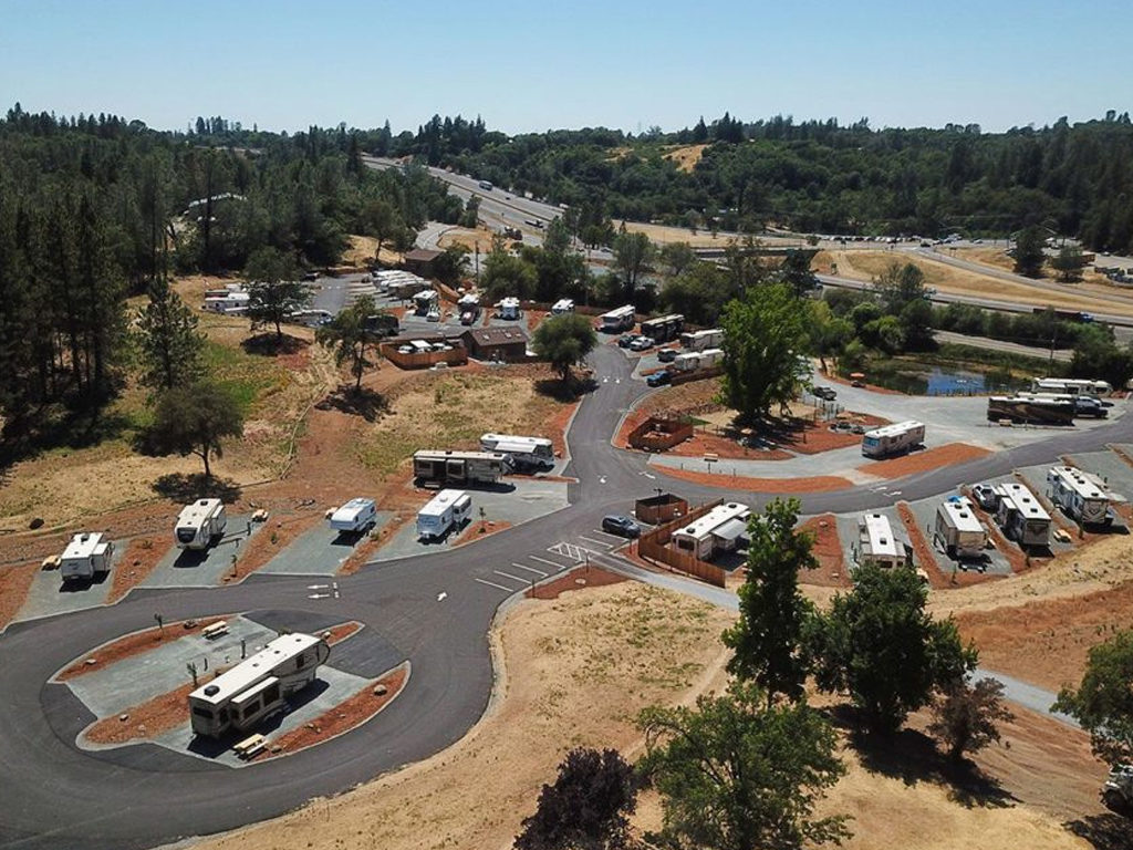 Aerial view of Auburn RV Resort showing the campground, RV sites and surrounding foothills